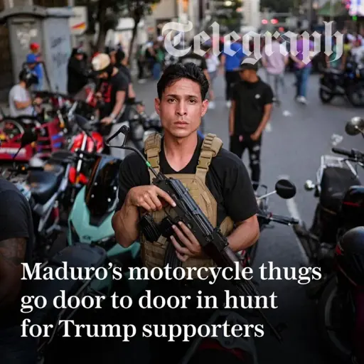 A Telegraph "news" article with the same title as this post. The image includes a man in a bulletproof vest holding a gun across his chest and looking at the camera.